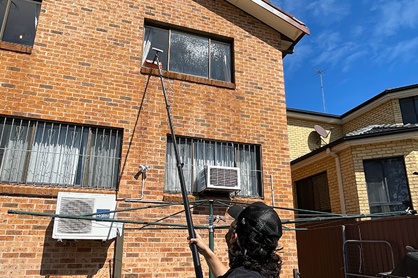 Soft wash window cleaning with water-fed pole in Wetherill Park, Sydney